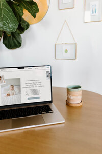 Laptop showing Showit website design for photographers