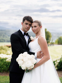 Sophisticated editorial portrait of a bride and groom in classic formal attire at The Biltmore Estate, showcasing the polished storytelling style of The Reeses.