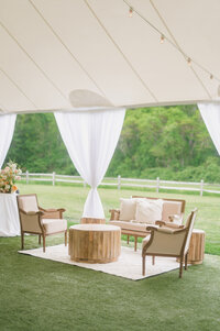 summer tented wedding with lounge seating.