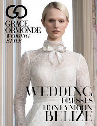 A bridal magazine cover featuring a woman in a lace wedding dress with a high neck and bow detail. The text reads Grace Ormonde Wedding Style and highlights wedding dresses and honeymoons in Belize.