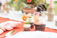 Wedding reception table scape with decorative cupcakes