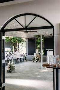 Looking through a doorway to the reception of a wedding at Brindabella Hills Winery
