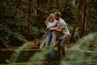 couple-spinning-intimate-smiling-forest