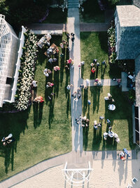 Aerial photography of a luxury outdoor cocktail hour on the lawn at Chatham Bars Inn in Cape Cod.