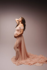 Expectant mother poses for Luxury, Editorial Style Studio Maternity Portraits at Holy City Babies Portrait Studio in Charleston, SC.