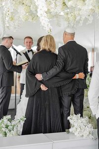 parents of bride embrace