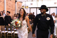 Bride and groom walking together outdoors after their intimate wedding ceremony