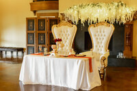 Venice Beach Los Angeles wedding photography detail of the bride and groom sweetheart table with elegant wedding decor, candles, florals, and true to life color.