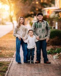 Brother and sister standing together during a downtown New Bern family photo session