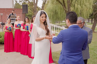 bride put the ring on groom's finger