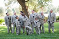 Groom at Wedding with his Groomsmen laughing. Wedding Photography located in Quitman Texas. Serving East Texas Mineola, Tyler, Winnsboro, Lindale, Van, Rockwall, Winnsboro