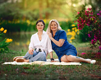 Multi generational family portrait with grandmother mother at a spring lakeside session