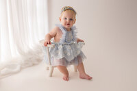 Baby celebrates her first birthday with Cake Smash Pictures at Holy City Babies Portrait Studio in Charleston, SC.