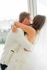 newlywed couple hug