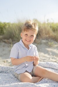 A coastal New England family session with toes in the sand and salty snuggles by the water's edge. North Shore Family Photographer. Deborah Zoe Photography.