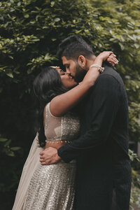 indian wedding couple kissing on their wedding day 