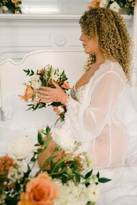 Joyful bridal portrait with peach and ivory bouquet by Flowergirl Cville at fall boudoir styled shoot, Staunton VA | Photo by Lyn Waldrop Photography