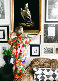 Personal brand photography of a female interior designer in a warm, styled home environment