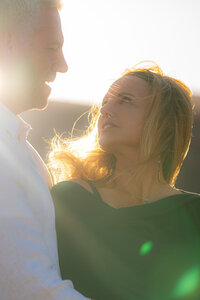 romantic couple sunlight sunset engagement photos by the golden gate bridge at cavallo point
