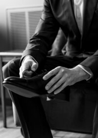 Detail shots of the groom putting his shoes on at the Troutdale House by the Sandy River.