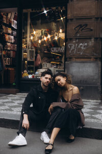Artsy and cinematic shot of a couple in Prague streets - urban editorial style with a nostalgic aesthetic