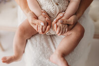 Charleston Motherhood Photographer - Mother poses with her baby during studio Mother's Day Mini Sessions at Holy City Babies Portrait Studio in Charleston, SC.