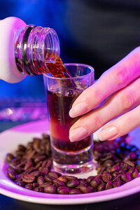 Liquor being poured into a shot glass