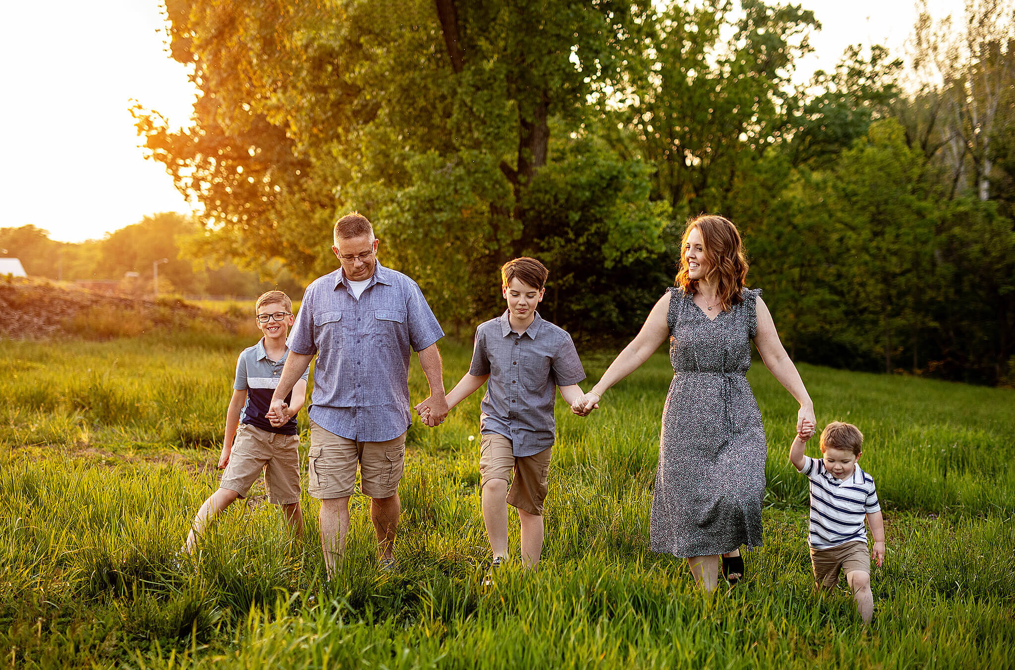 Family of five walking at Aumiller Park in pretty light