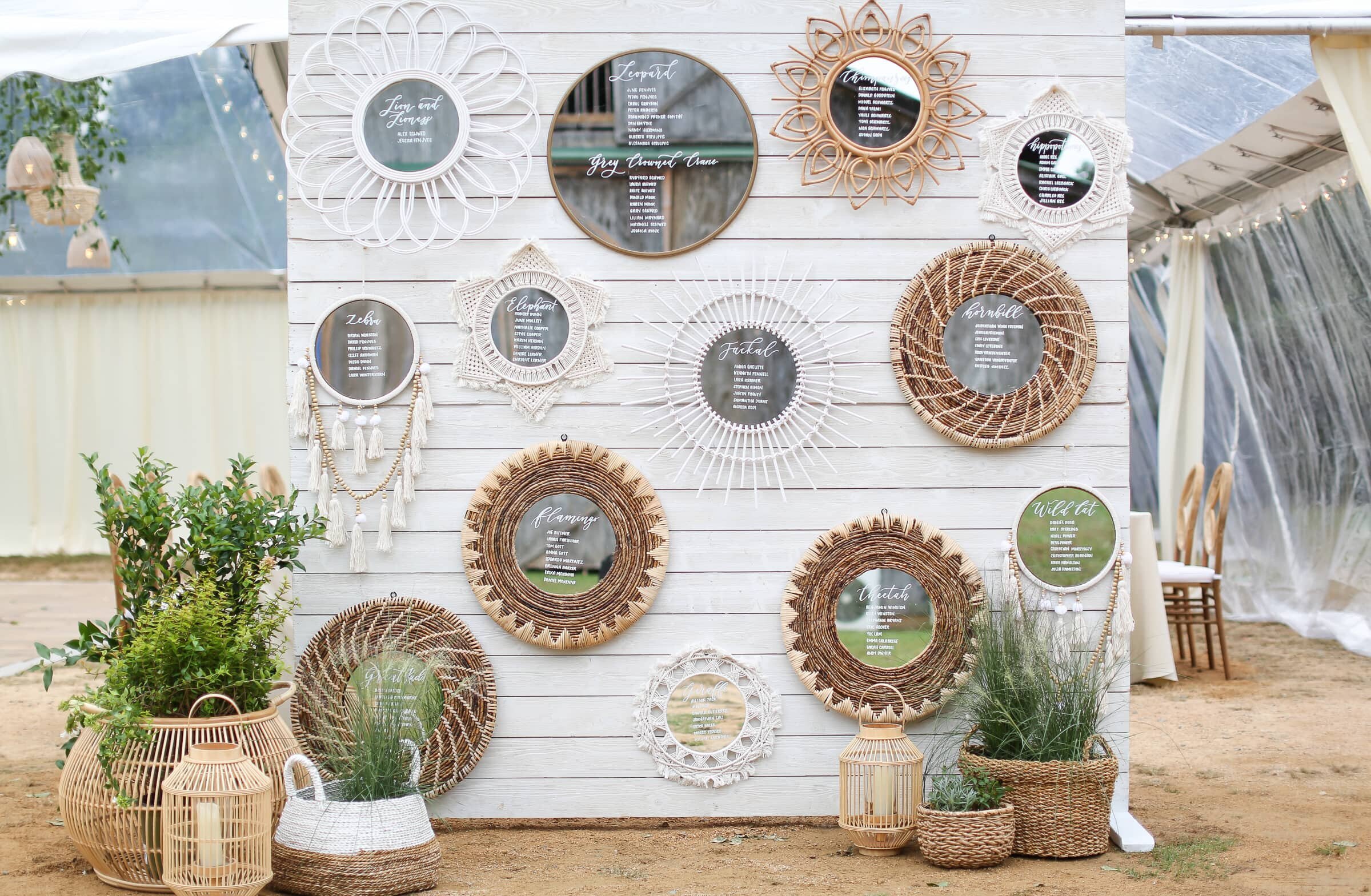 boho seating chart wall with mirrors.