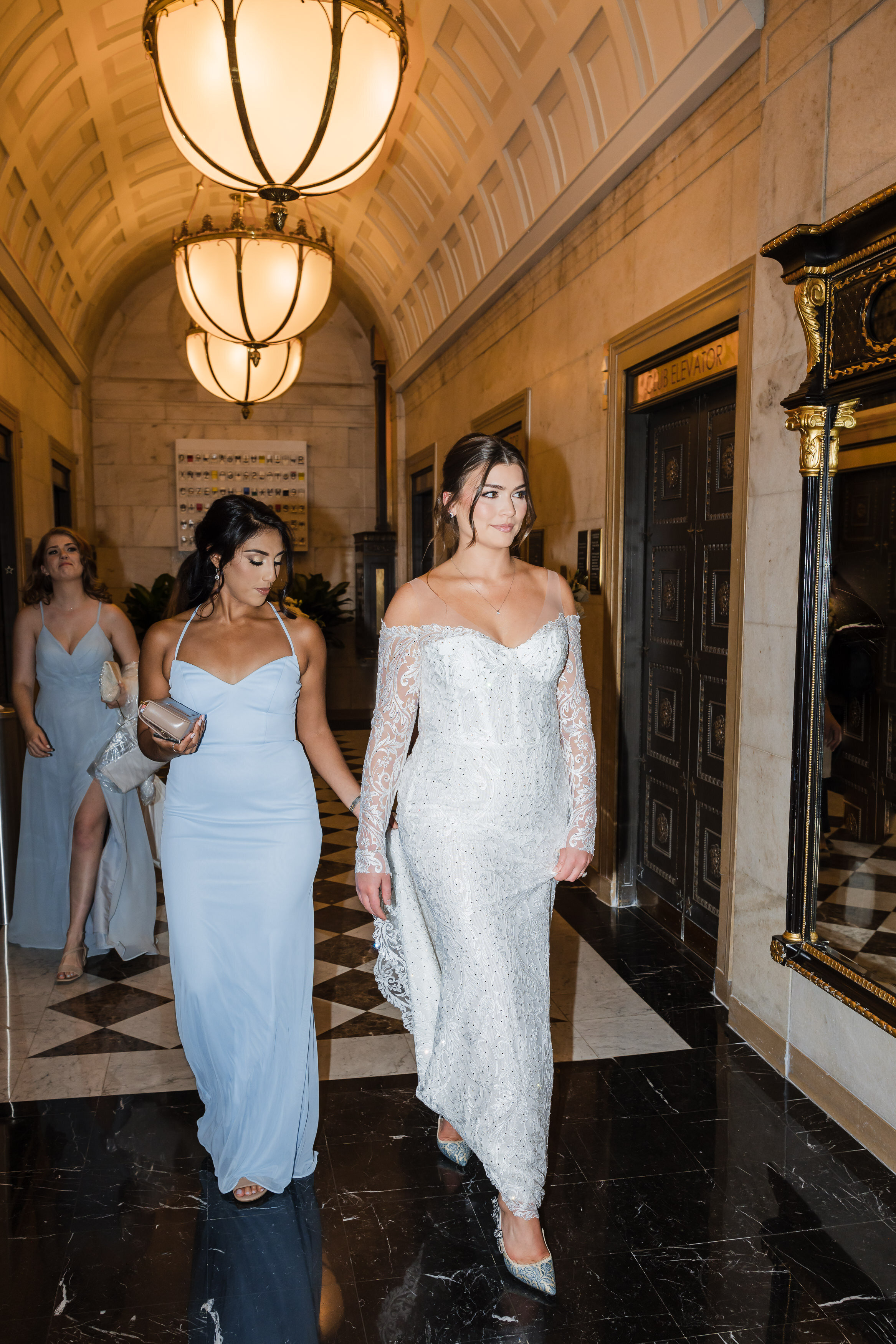 Editorial flash photography style  photo of the bride walking at the elevator area at Ritz Carlton wedding in Philadelphia.
