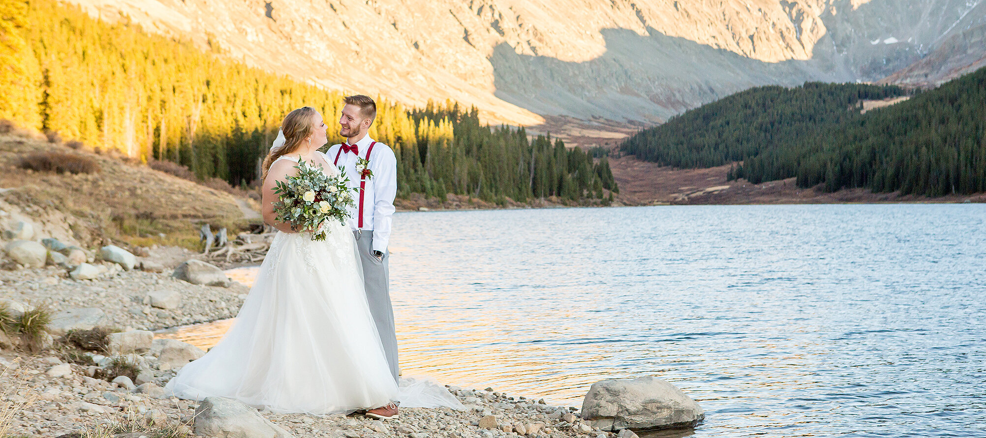 Colorado wedding photographer with couple at Clinton Gulch Dam Reservoir