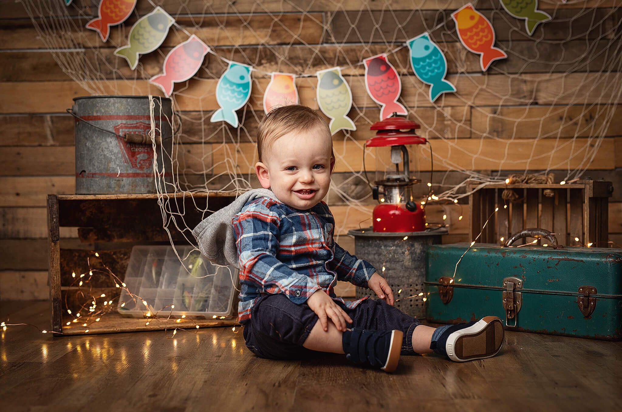 one year old boy with fishing background
