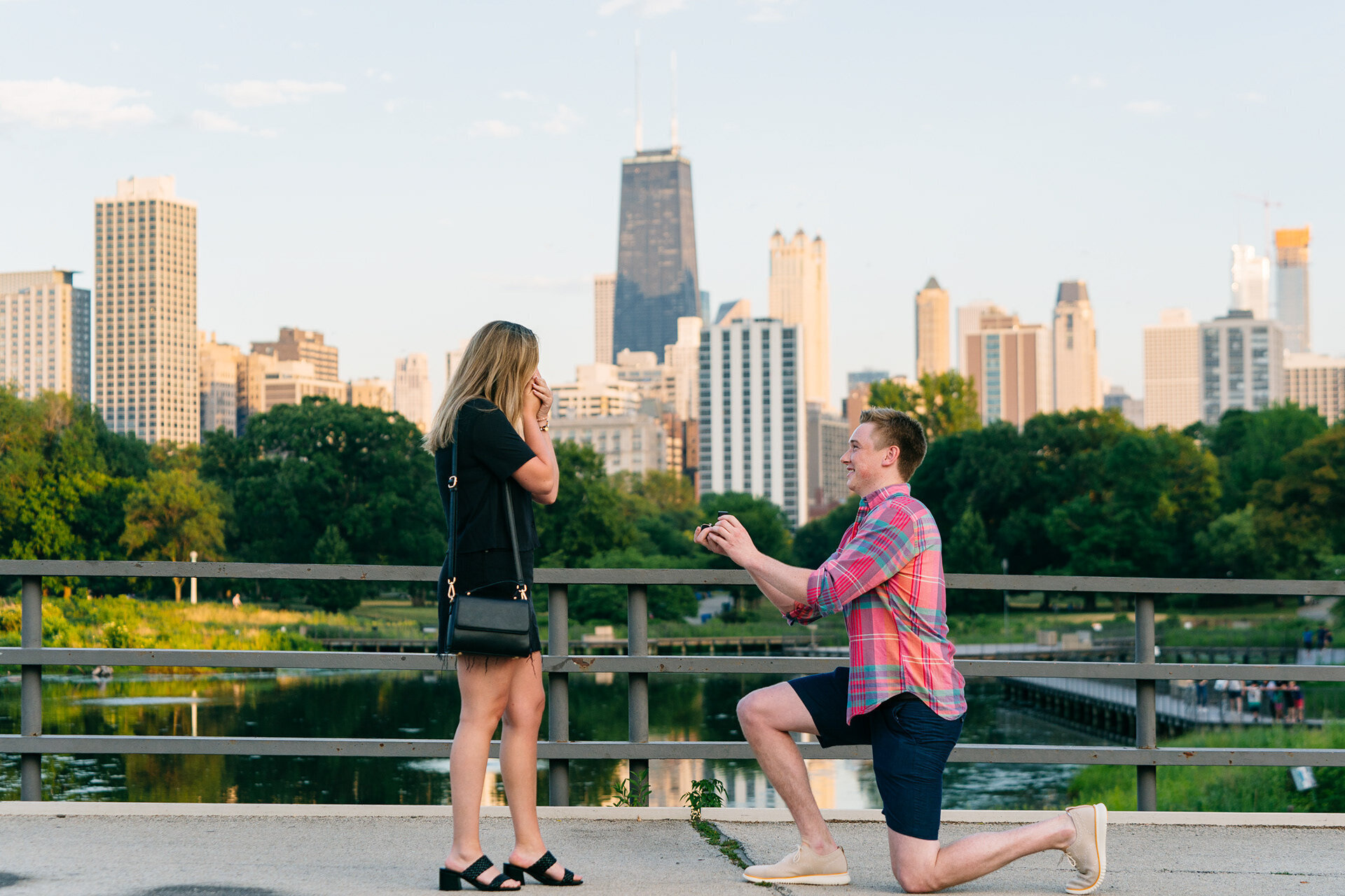 Proposal on the Bridge Over South Pond in Lincoln Park with the Chicago skyline in the backdrop