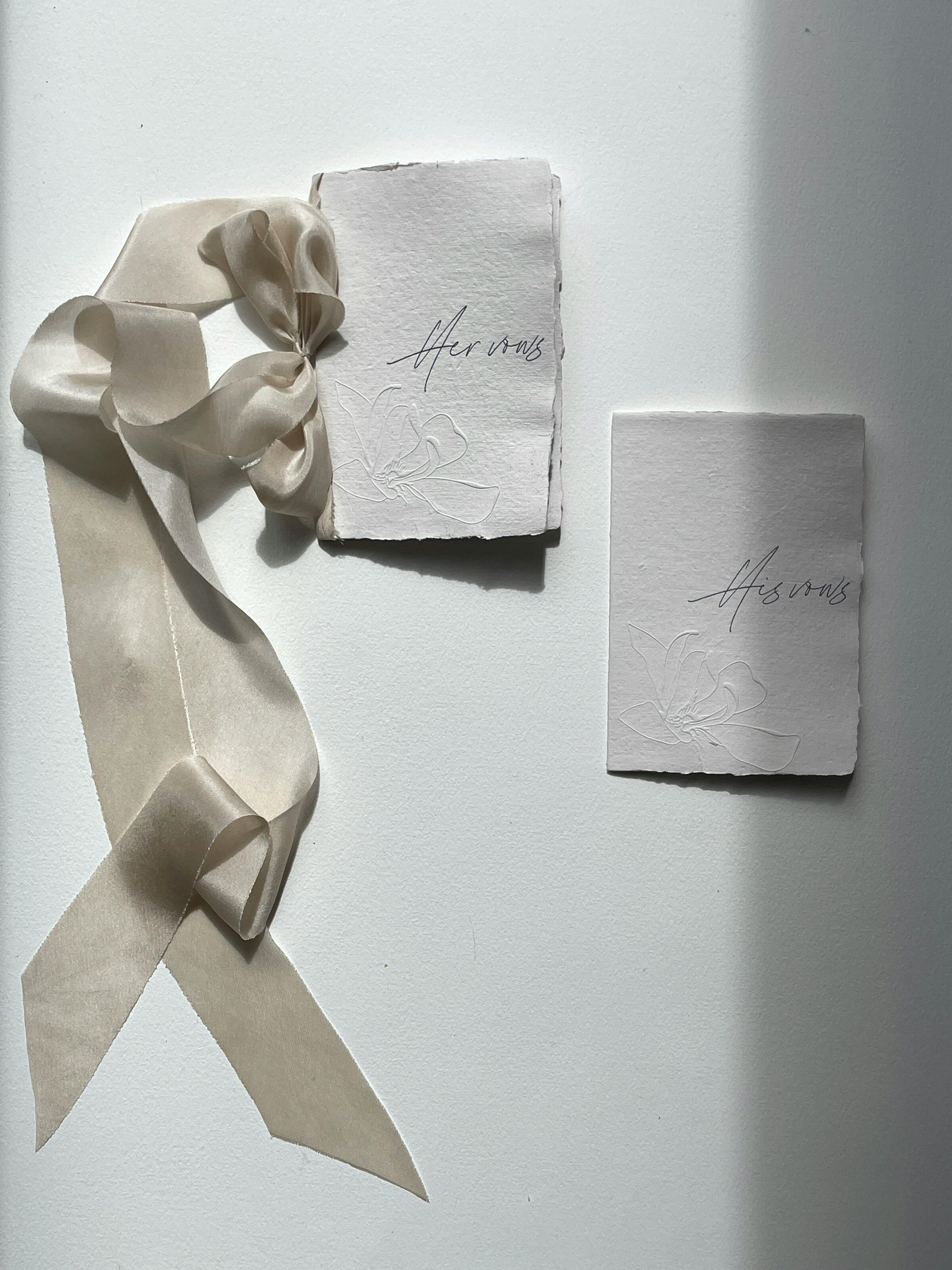 Editorial-style photo of elegant vow books, beautifully styled with delicate details, capturing a sentimental moment before the wedding ceremony in Columbus, OH.