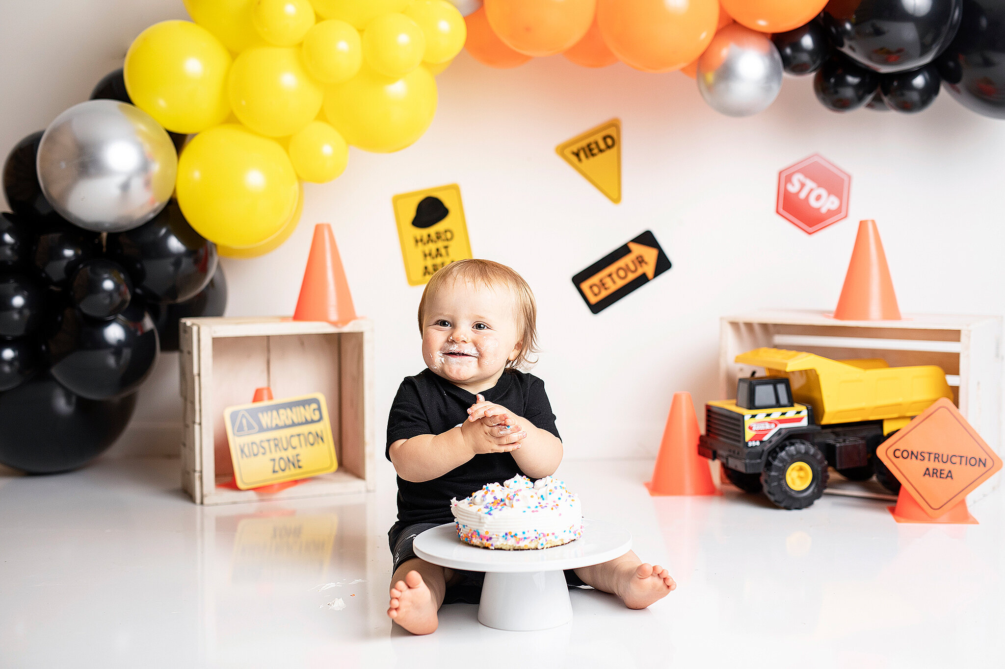 One year old boy with construction cake smash at bucyrus ohio photography studio