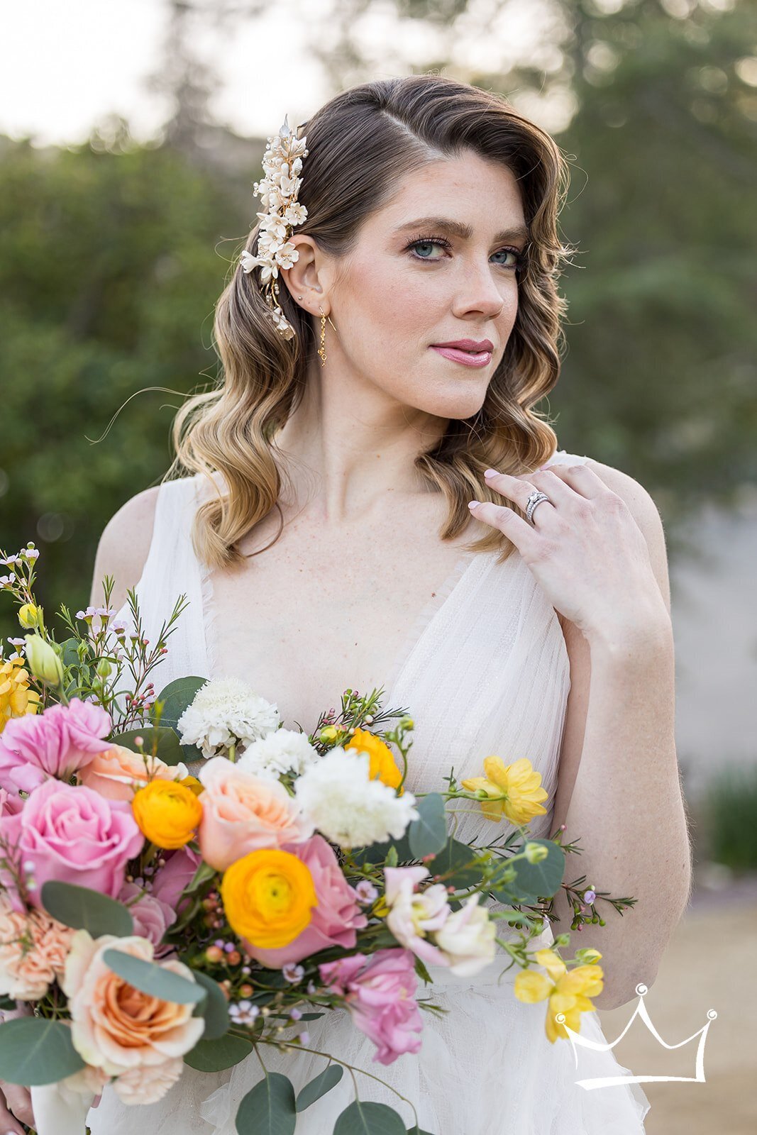 Trista in a wedding dress, holding a bouquet of flowers.