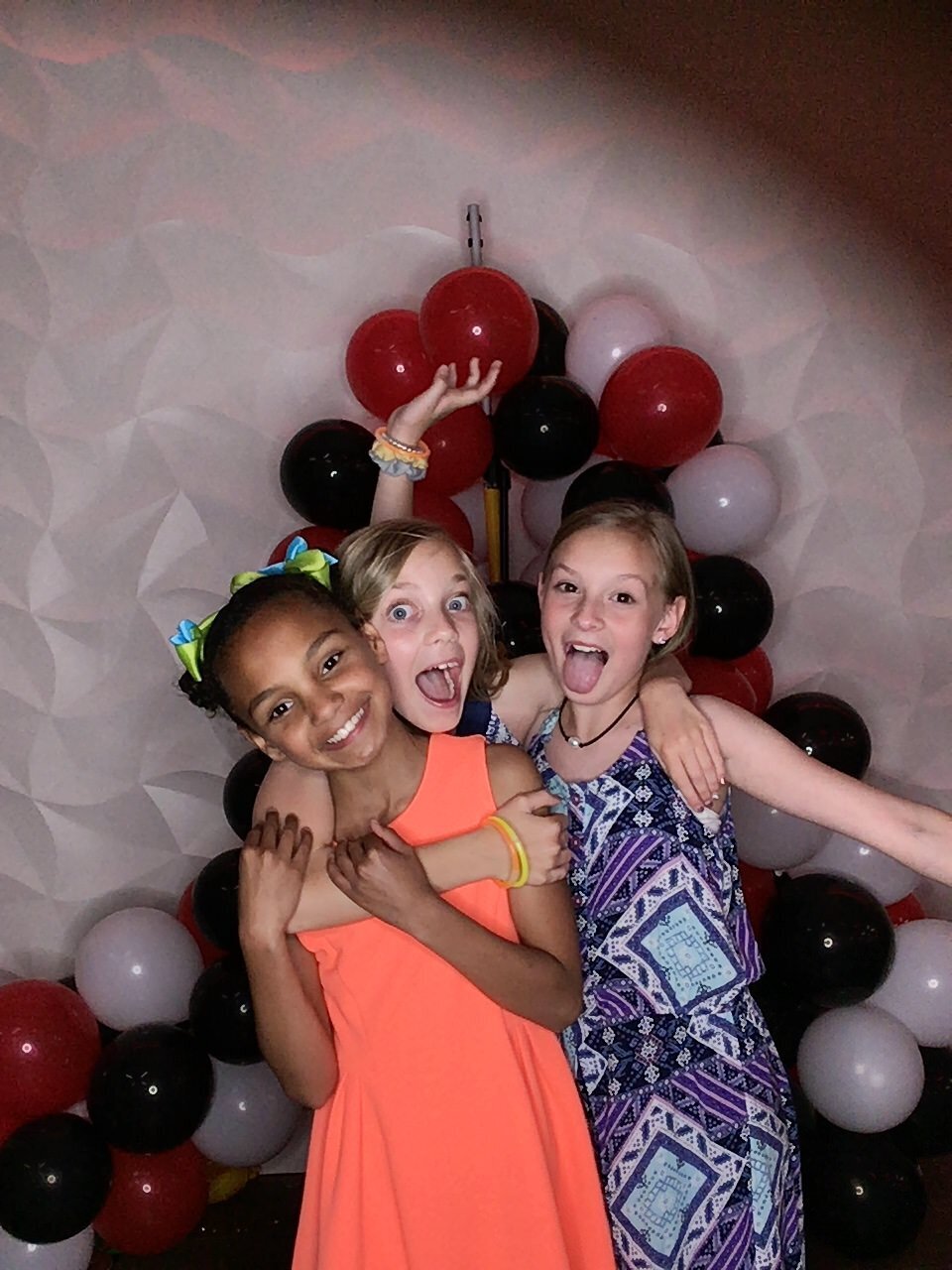Friends together in photobooth for their sports event gala at The Fountains at the Gateway