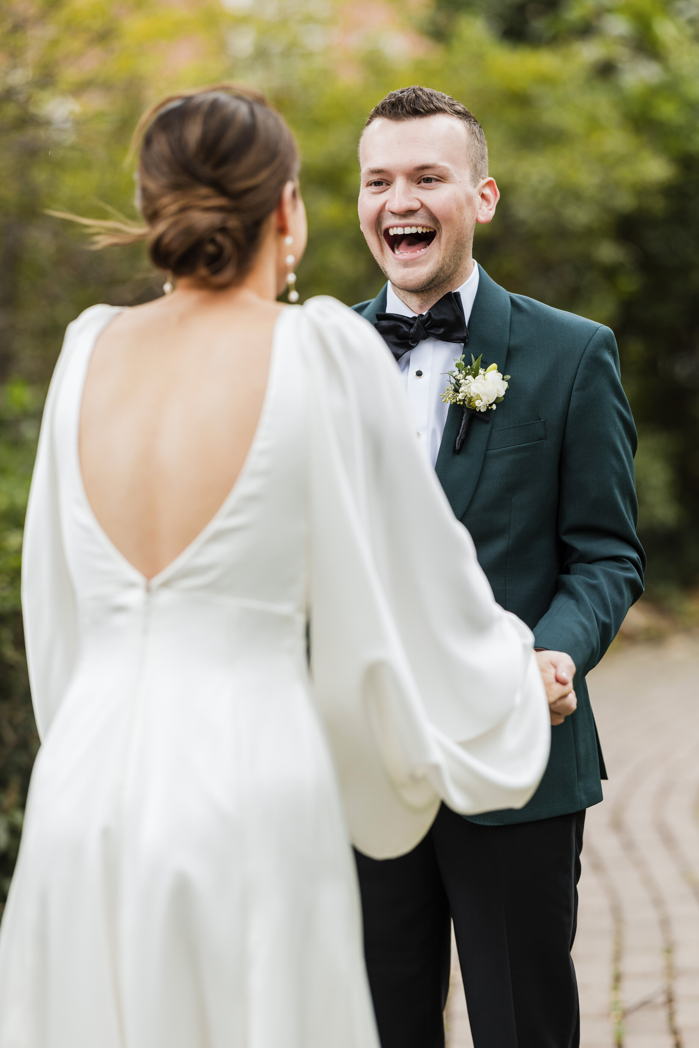 Groom's candid reaction when he sees his bride for  their first look in the Old City in Philadelphia