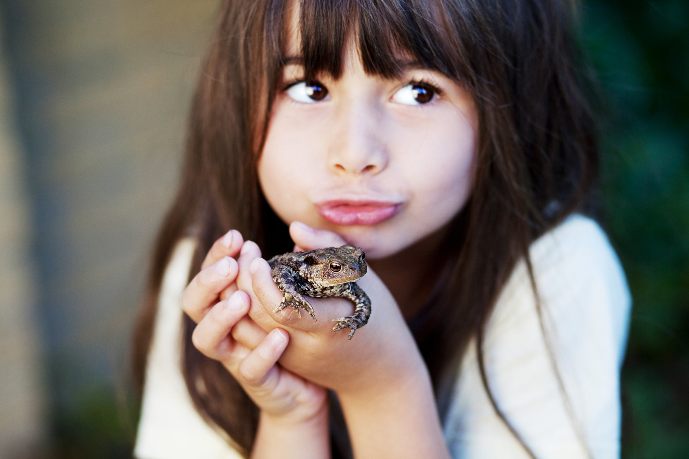 girl kissing frog
