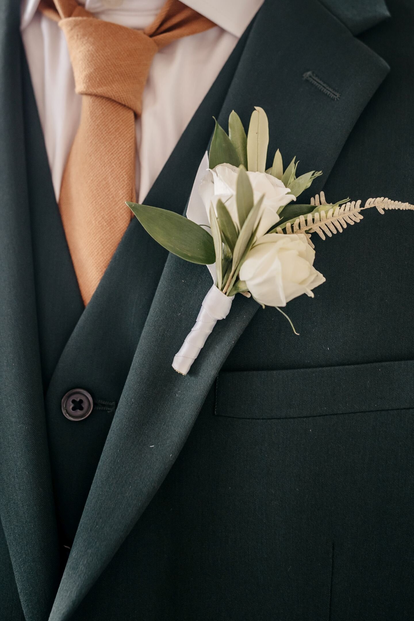 Boho inspired boutonniere for groom