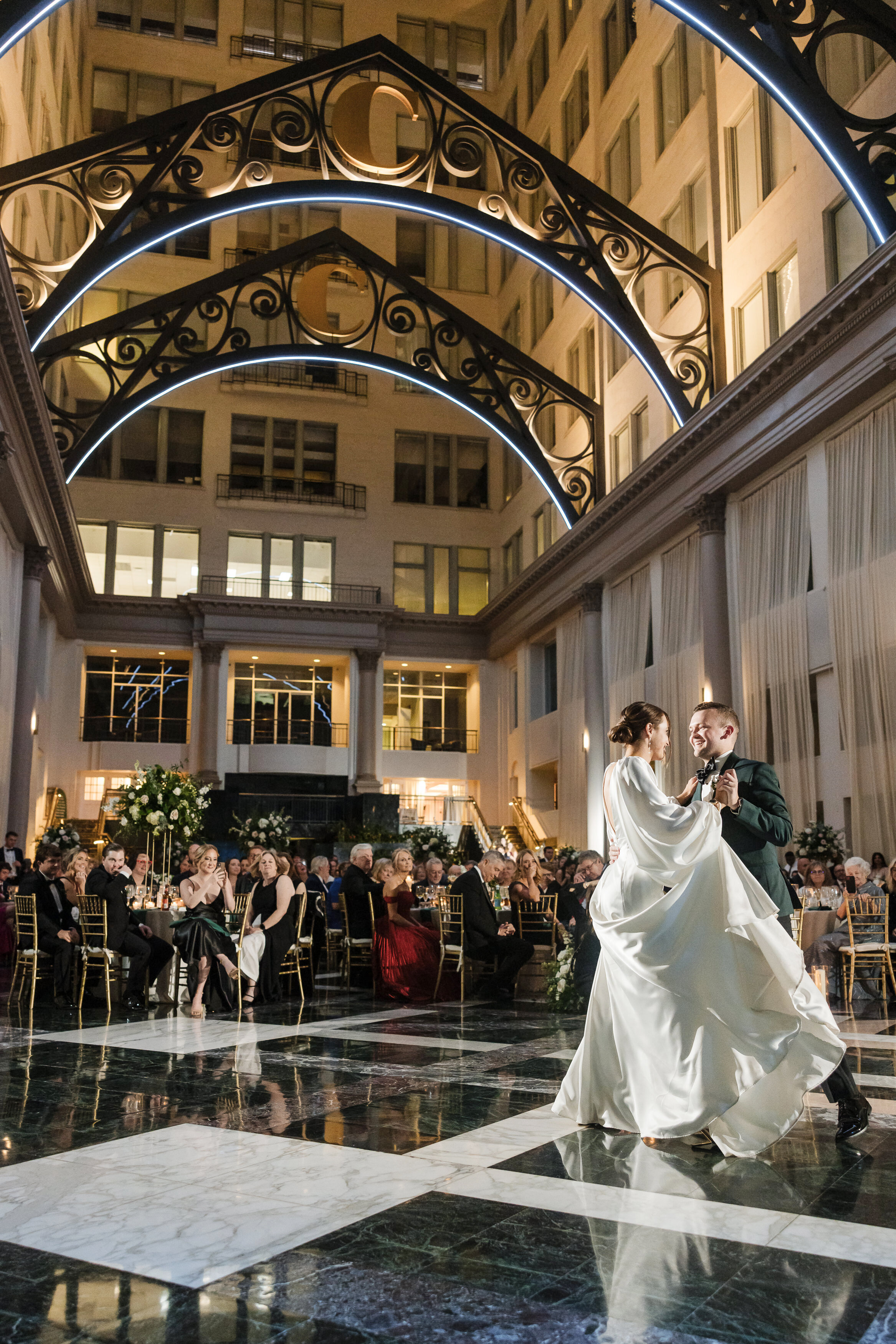 First dance of the bride and groom at their wedding reception at Curtis Atrium Philly wedding.
