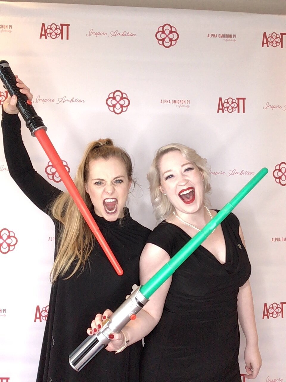 AOII sorority sisters with lightsabers in photobooth