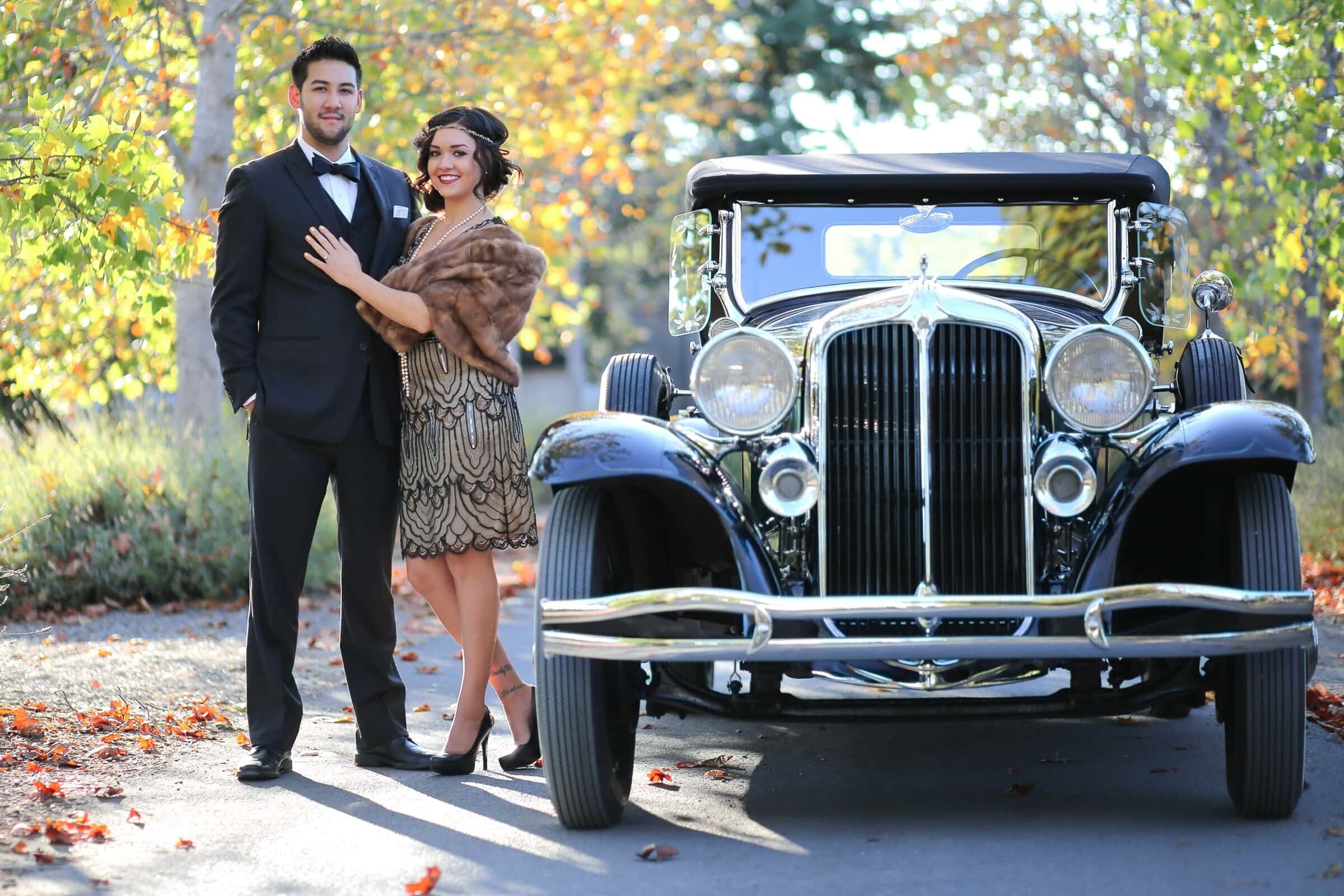 engagement session 1950 themed. Fiance and fiancee posing by a  vintage car.