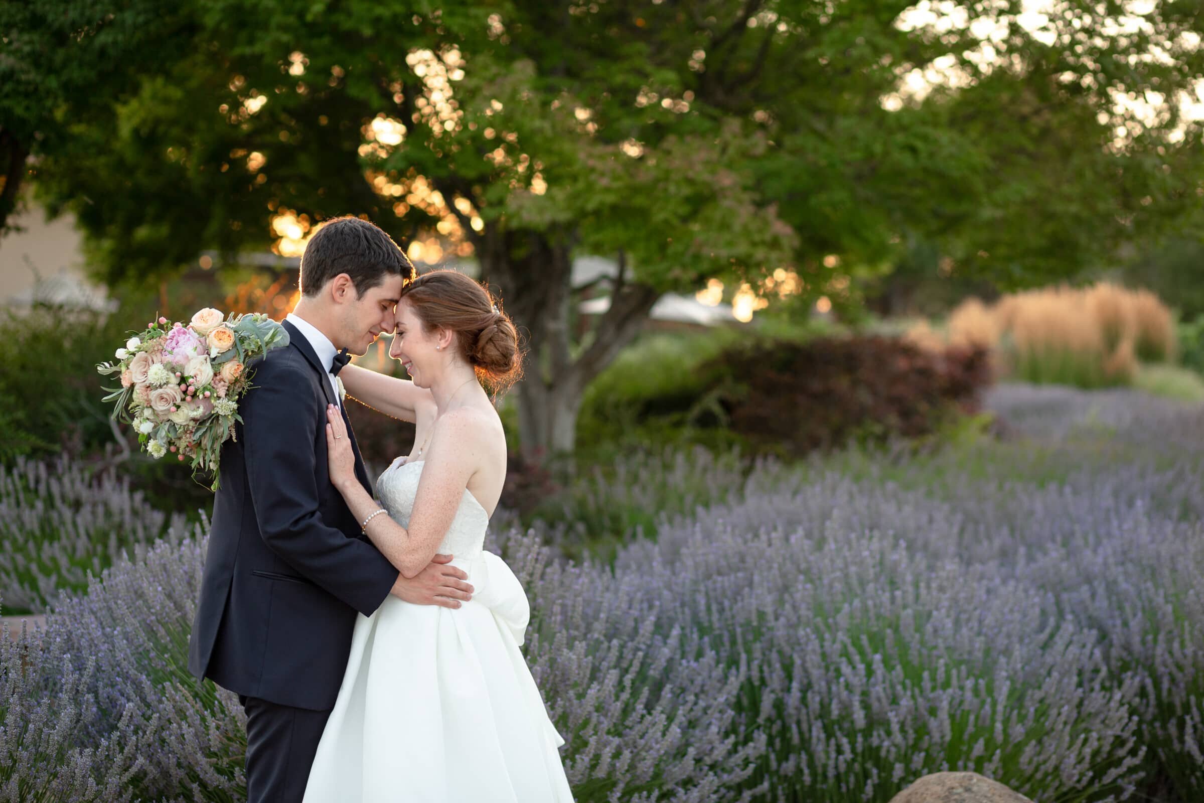 bride and groom romantic moment among lavender field in  Sonoma CA