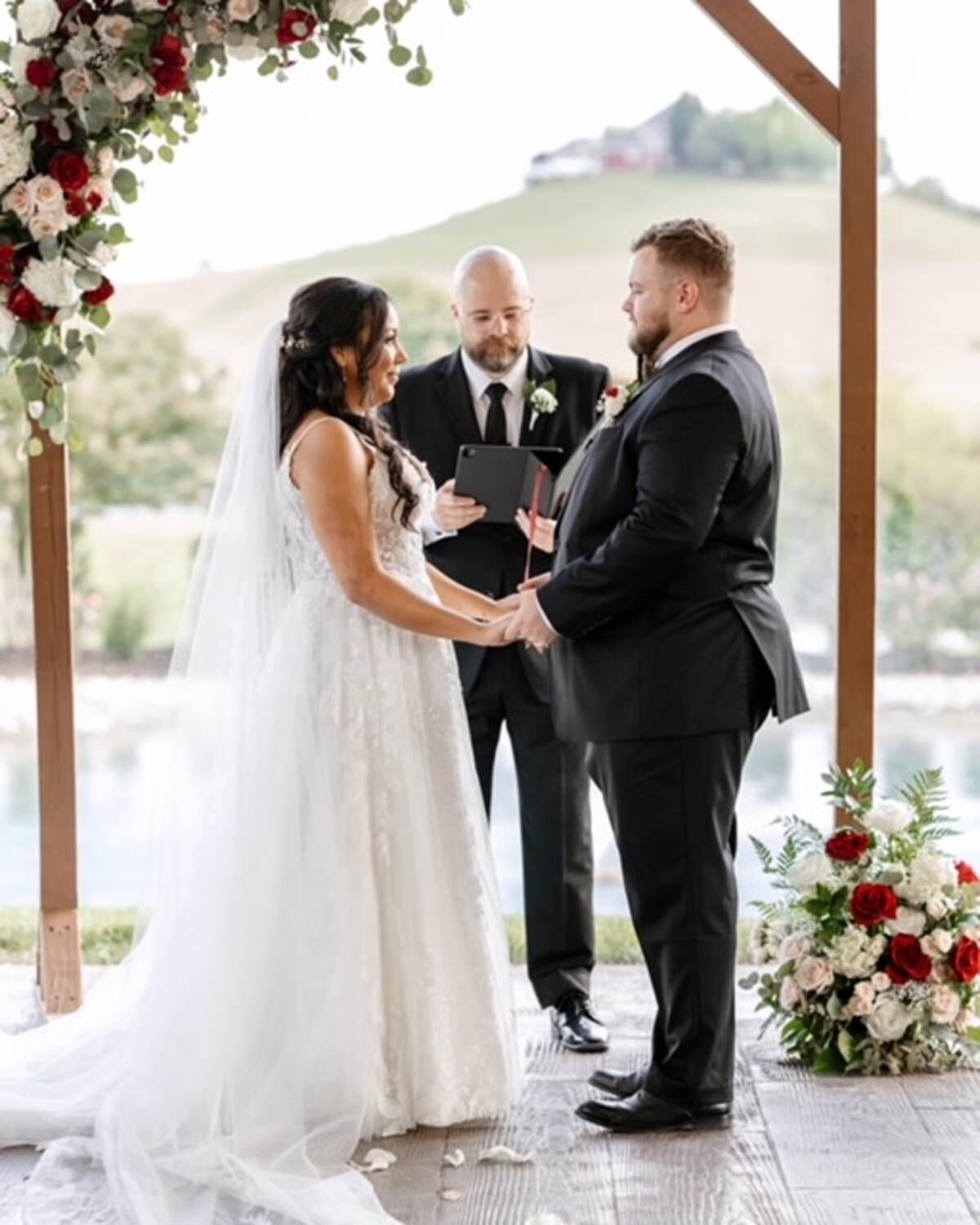 Couple exchanging vows at White Dove Barn