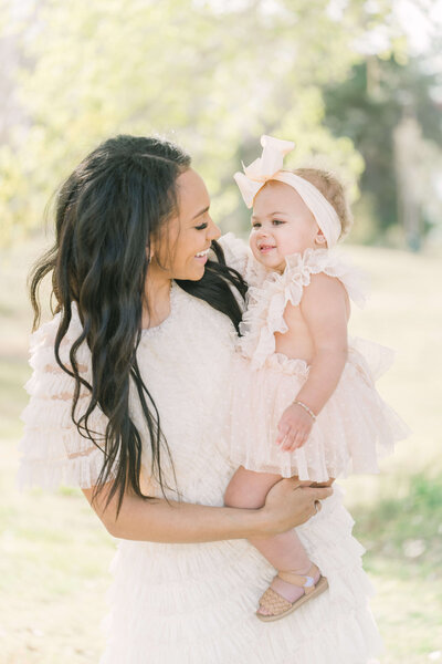 fallback shared on Invalid Date | Mom holds baby and they share a laugh together.