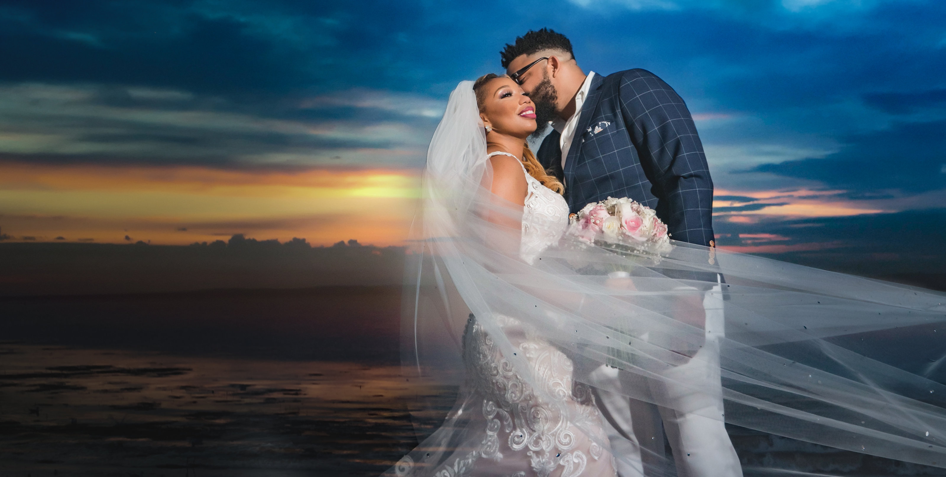 amazing sunset portrait of couple on the beach after wedding
