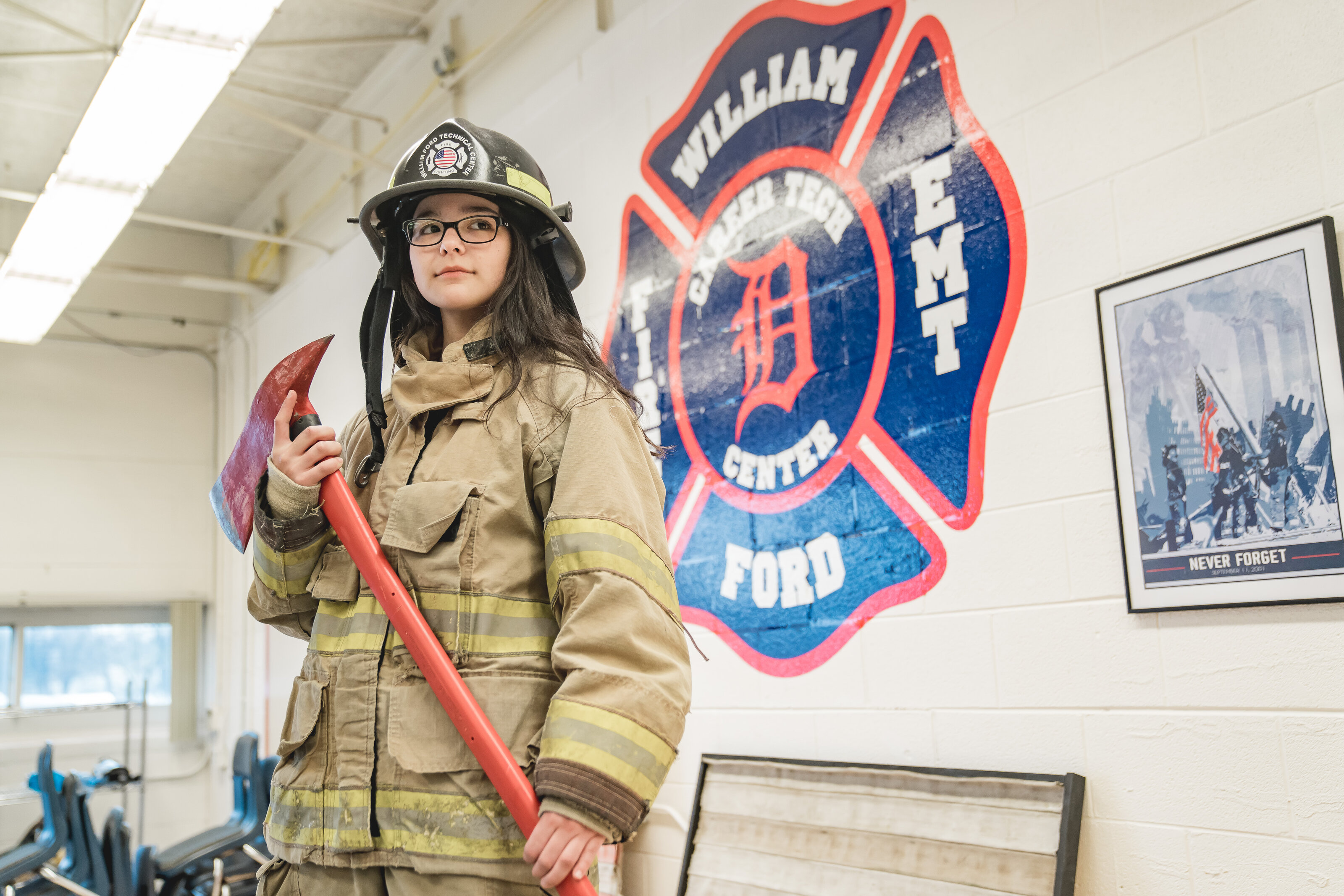 Cultivate Engage woman firefighter in full gear holding an axe