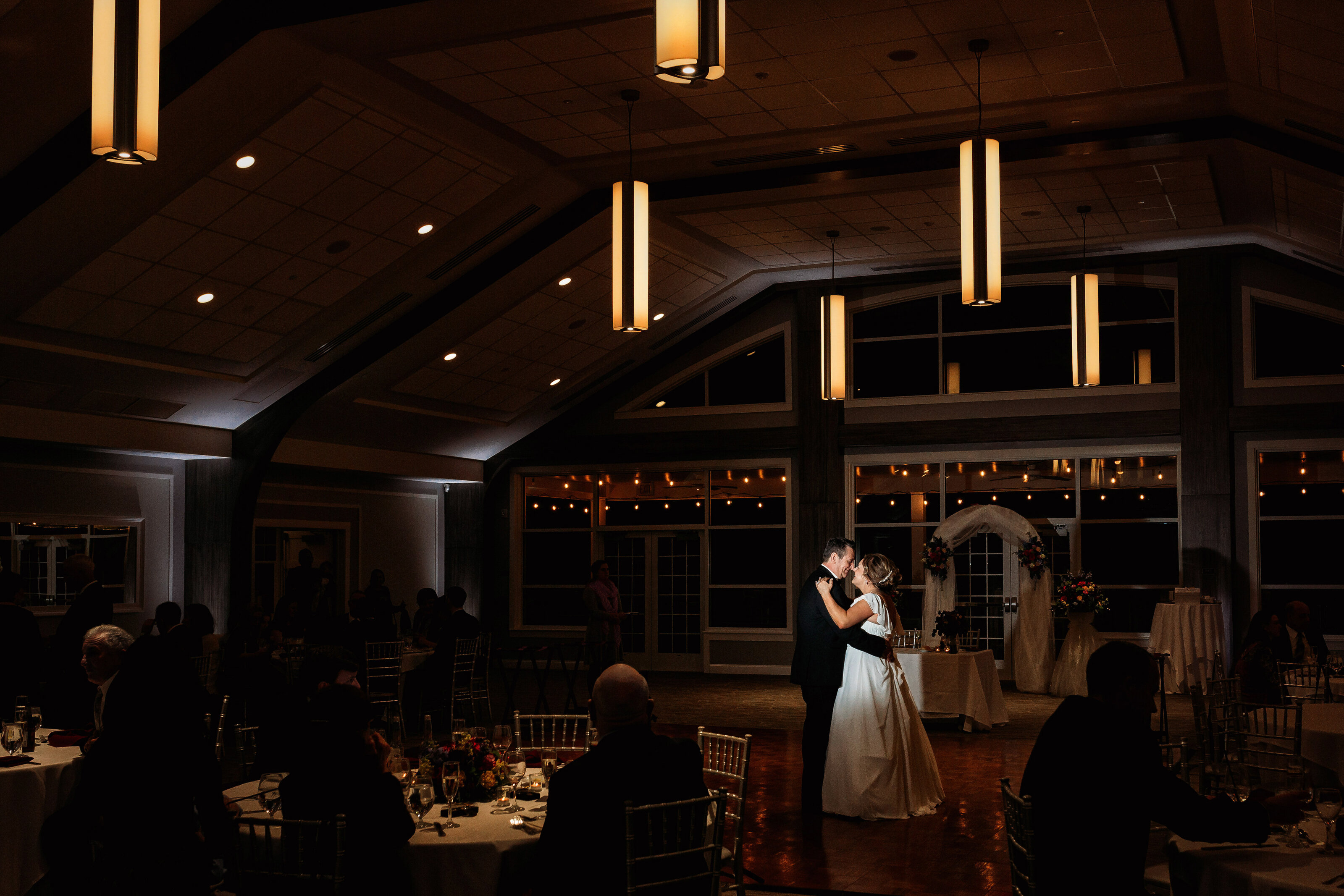 Married couple dances for photos on their wedding day at the Mercer County boathouse in New Jersey