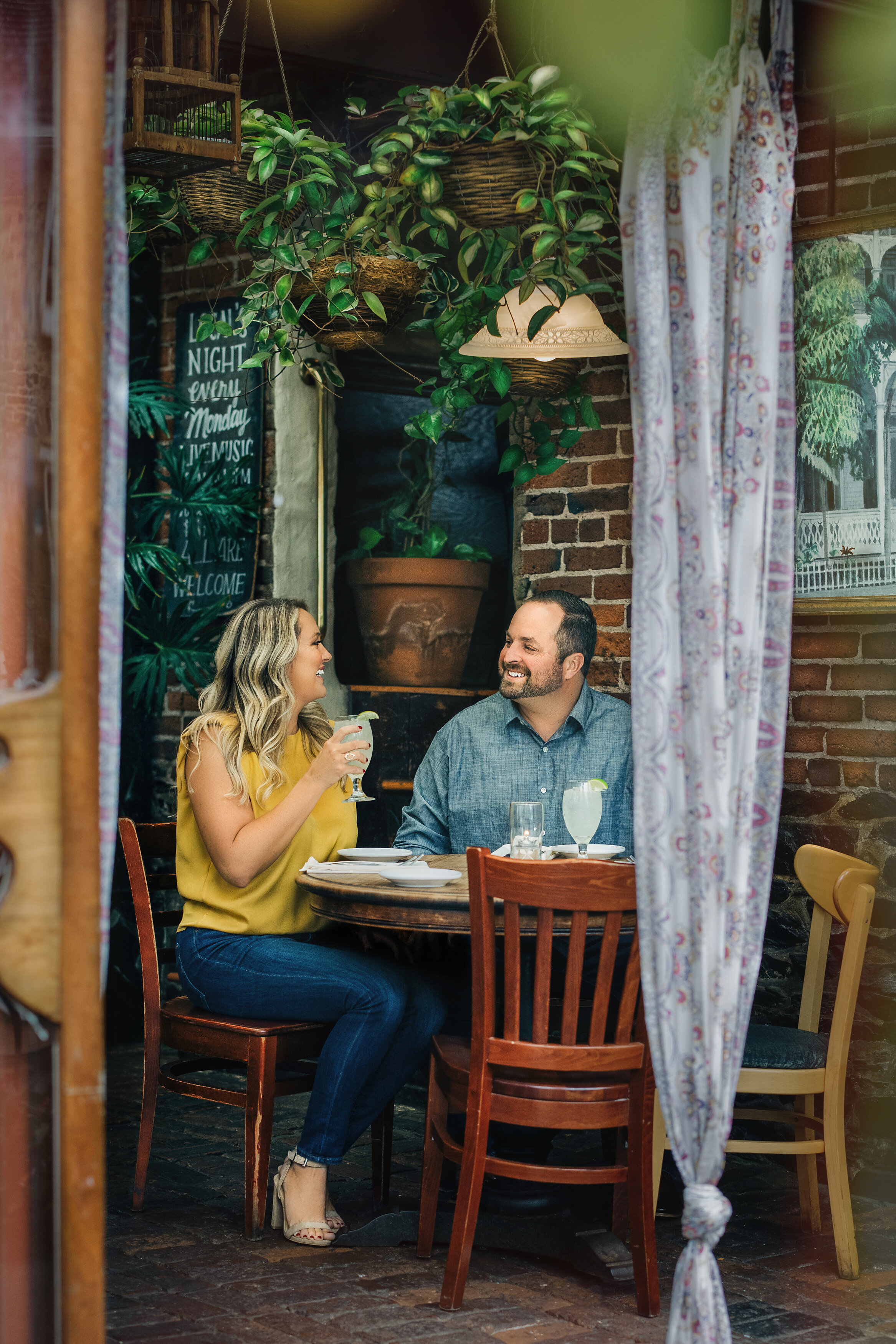 couple has drinks in New Hope, PA for their Engagement photography session.